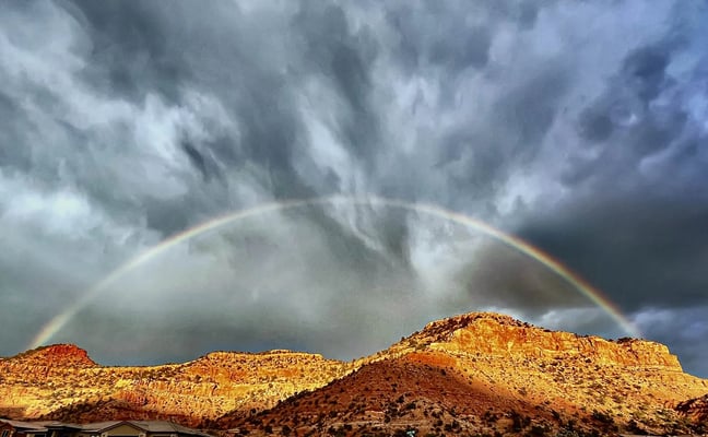 Double rainbow over red rock canyon walls at Zen Zion